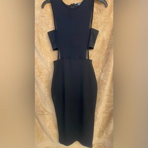 Black small dress with sheer too with a black bandeau across the bust.